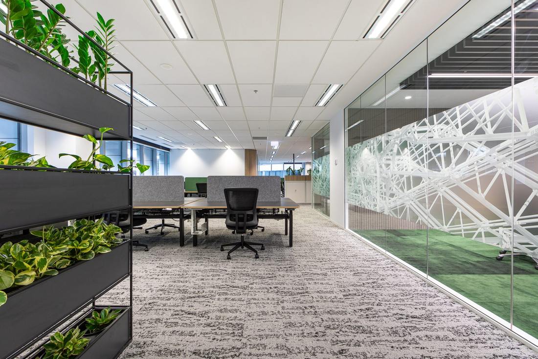 DBM Vircon commercial office fitout in Perth with sit stand workstations and planted screening