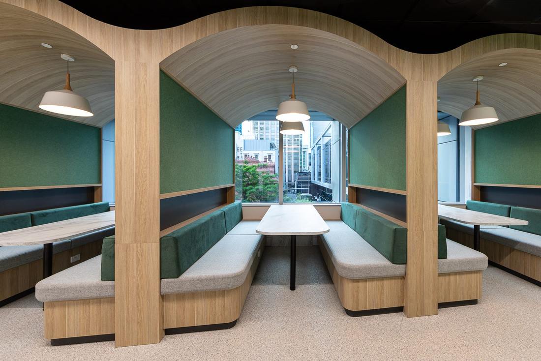Arched timber booth seating in the DBM Vircon office design and fitout, Perth