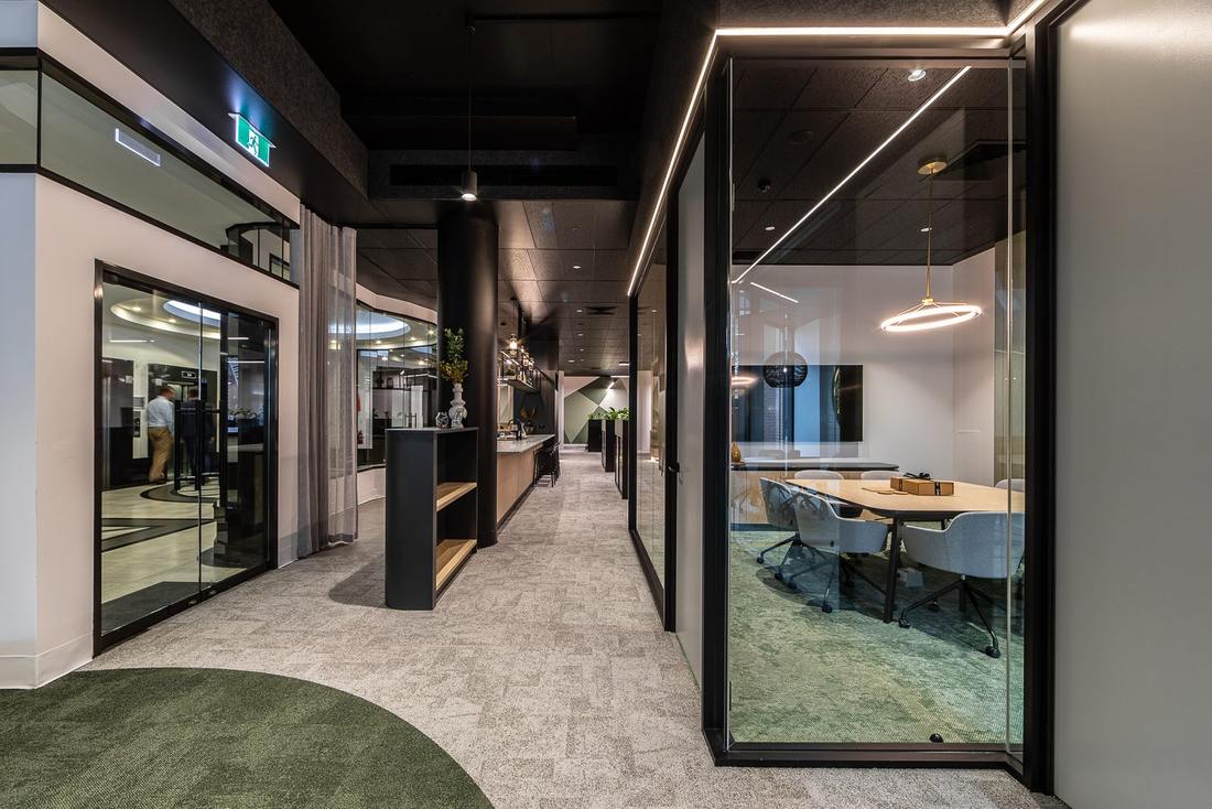 McKinley Plowman office fitout in Perth with glazed meeting room and central café bar