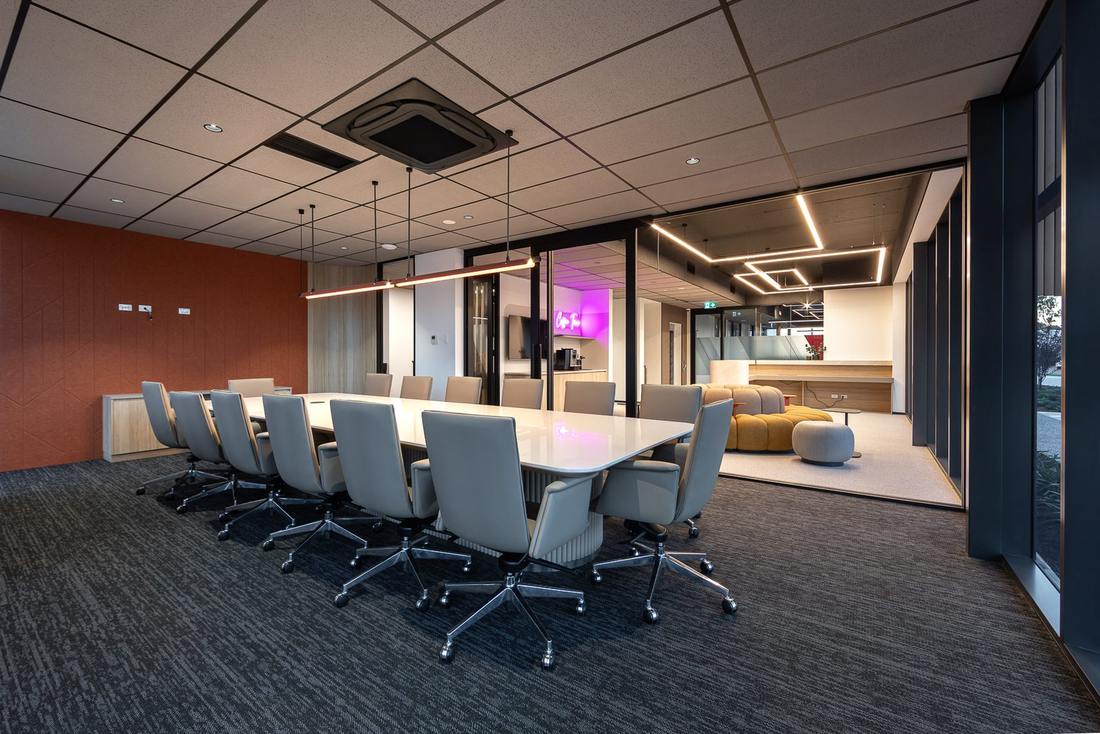 Boardroom in the Pressure Dynamics office fitout, Perth, with terracotta acoustic wall panelling