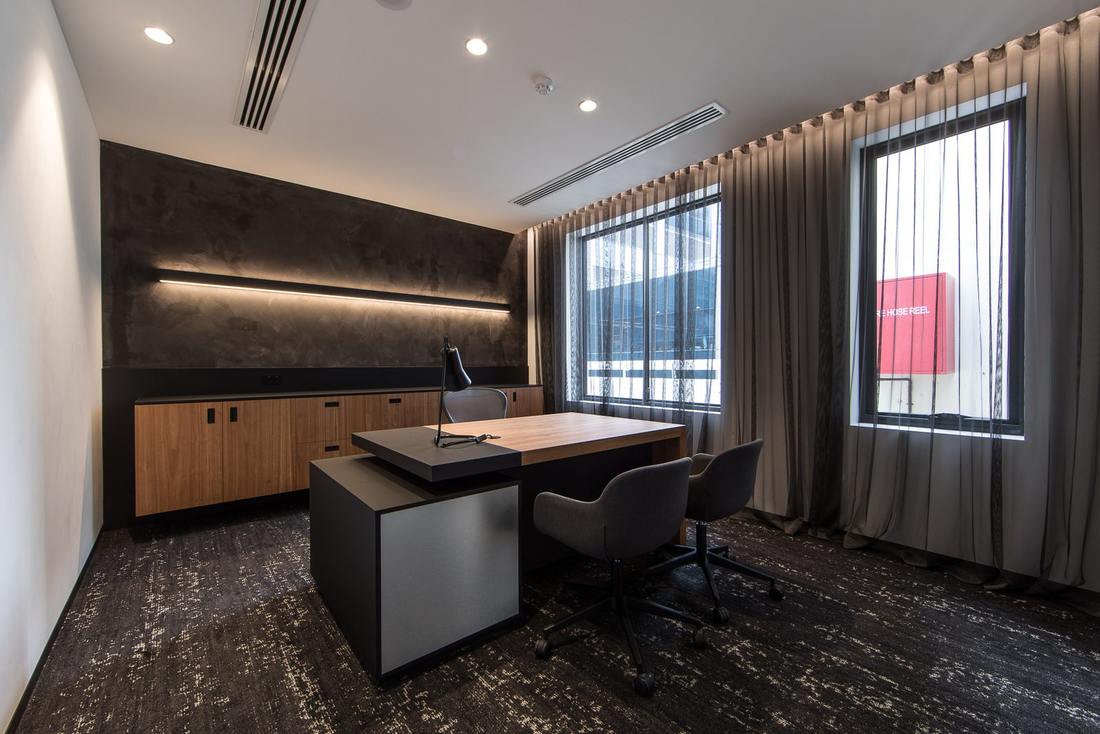 Executive office with textured feature wall from the Rollason commercial office renovation in Perth